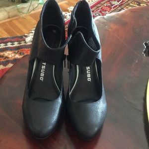 Black leather high heel booties.